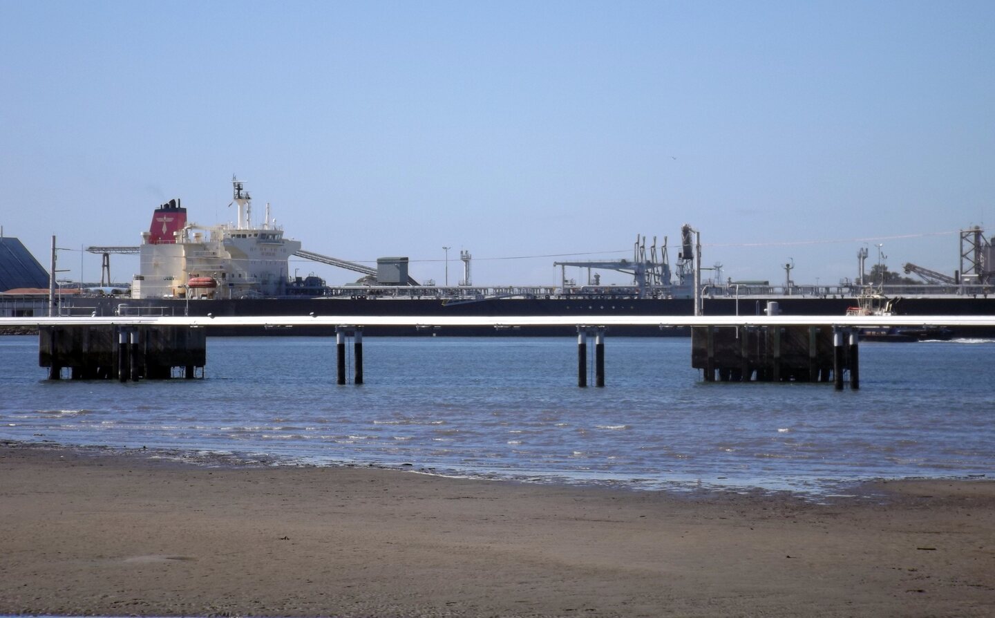 A ship docked at the Port of Brisbane, viewed from Pinkenba